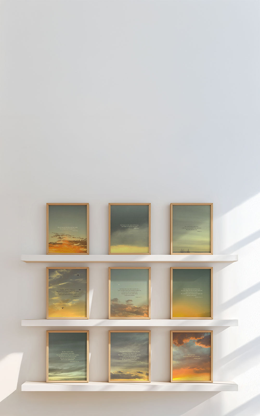 Framed Scripture art prints on a white shelf against a light wall for mobile header.